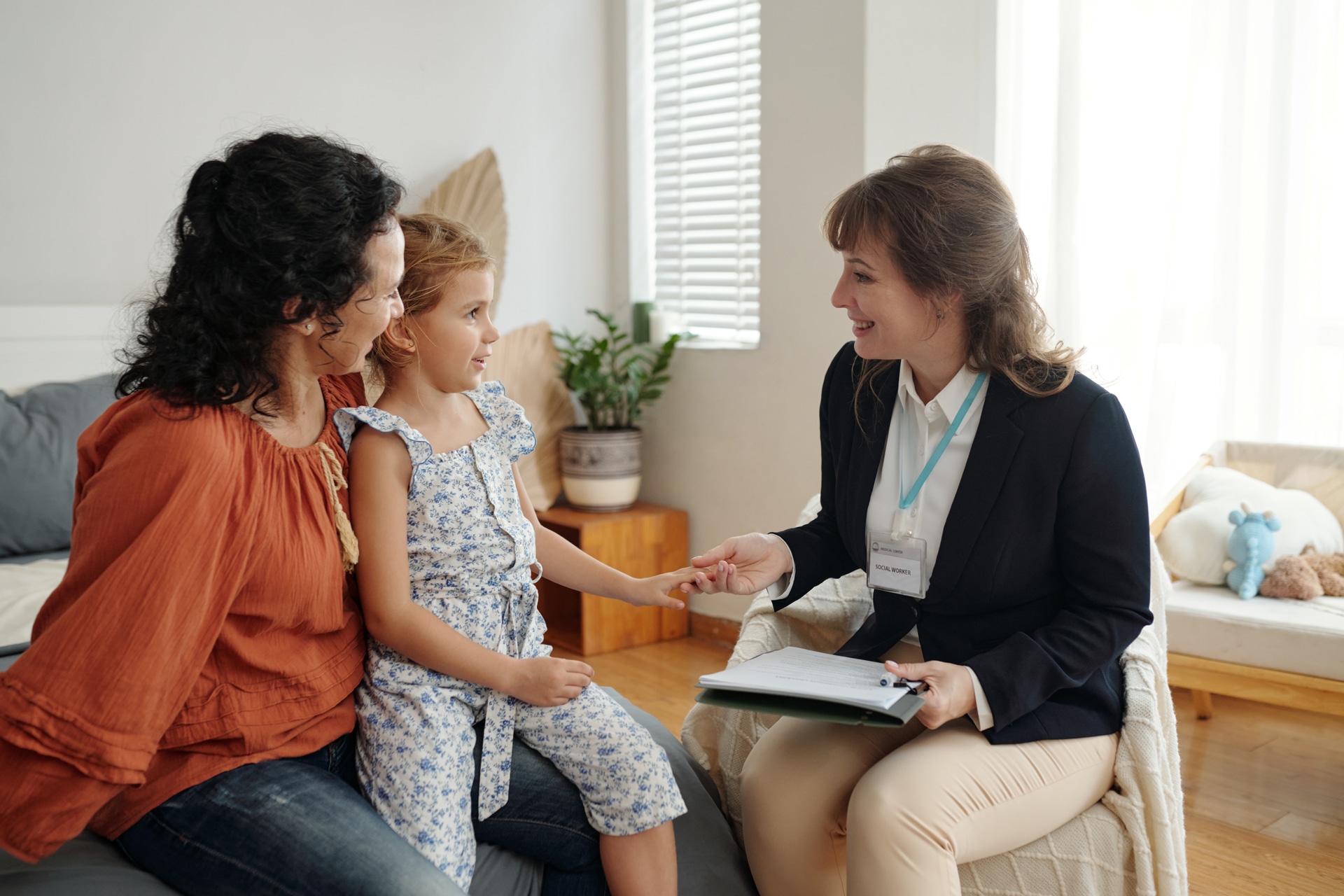 Parent and child meeting with a therapist to discuss OAP funding support at Young Sprouts Therapy in Thornhill