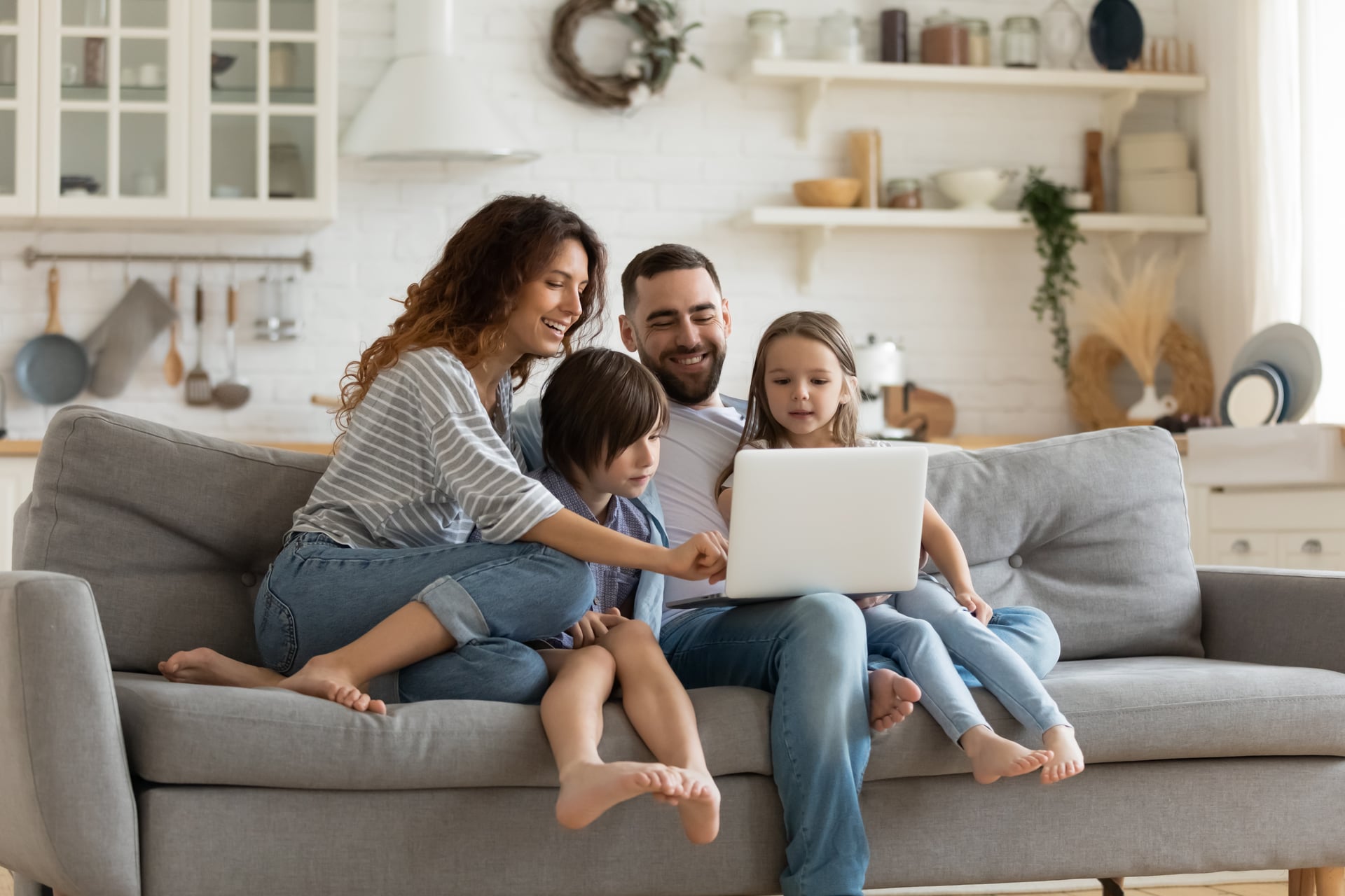 Two parents sitting together on a therapy couch, looking attentive and hopeful as they consult with a professional, warm and supportive atmosphere