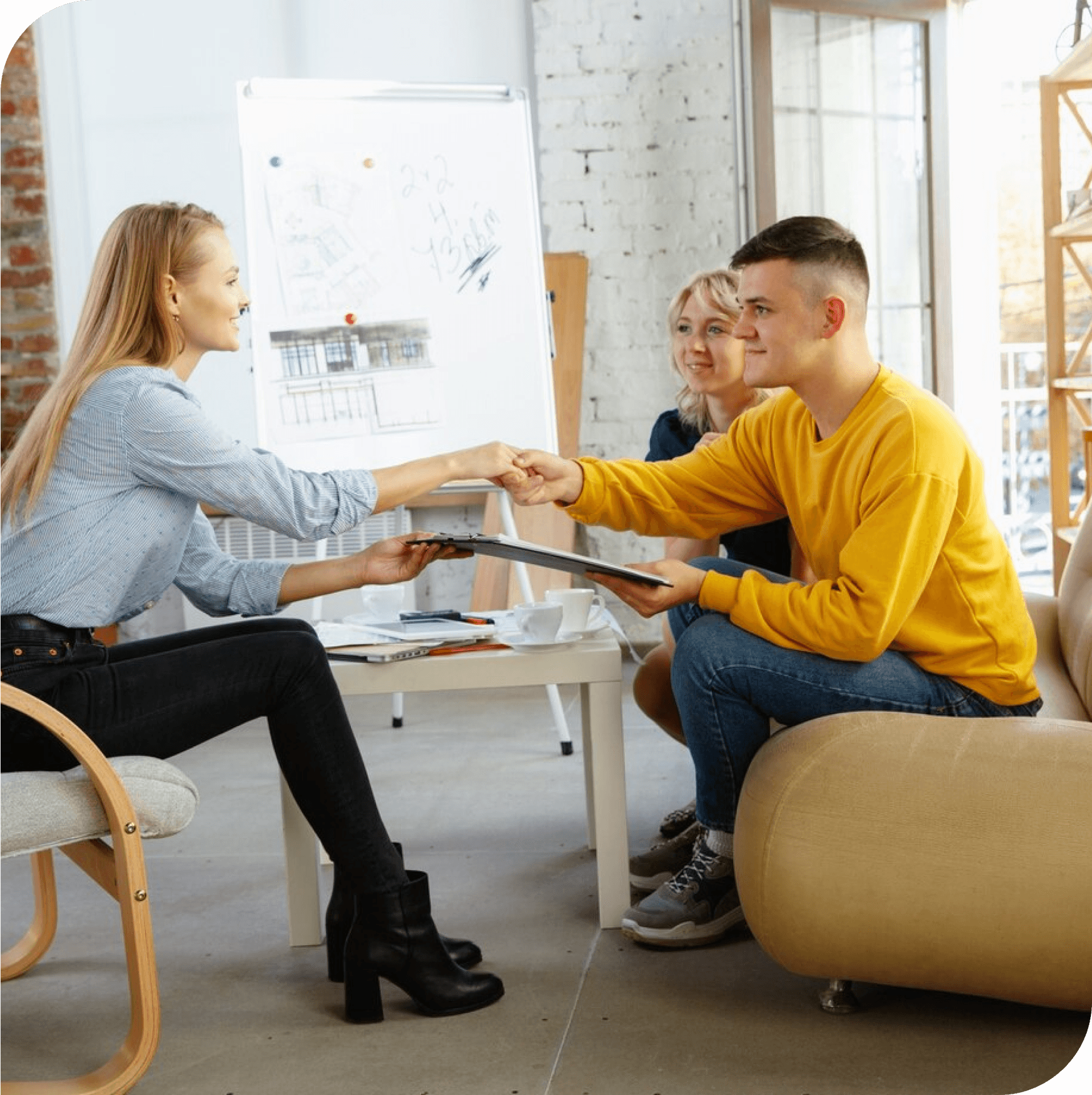 Young adults and therapist smiling during ACT therapy session. Support for trauma recovery and life transitions in Thornhill, Vaughan, North York, Markham, and Richmond Hill.