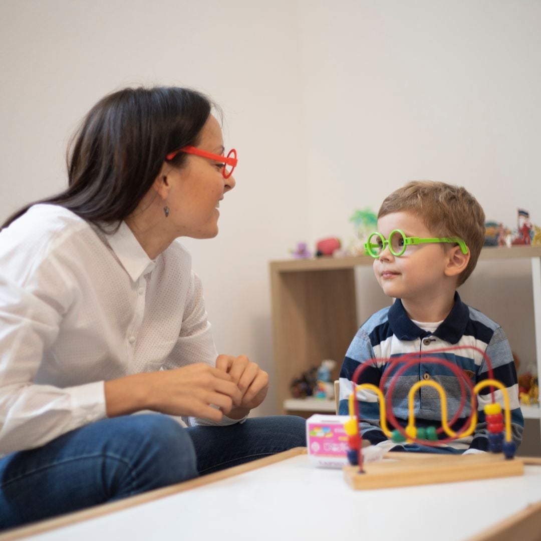Parent and child meeting with therapist for autism support and parent coaching at Young Sprouts Therapy