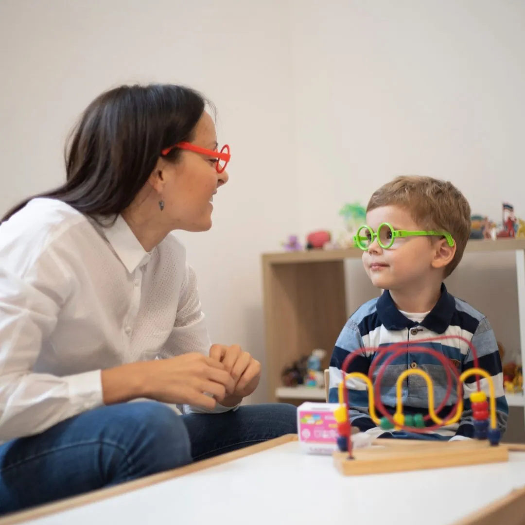 Parent and child meeting with therapist for autism support and parent coaching at Young Sprouts Therapy