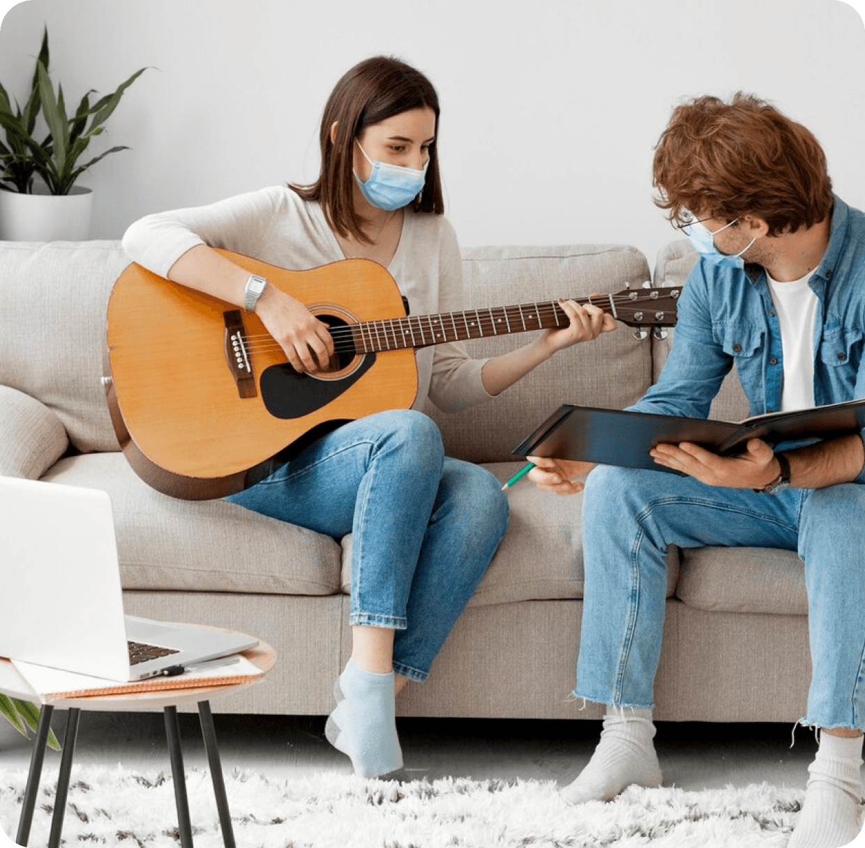 Music therapist guiding a teen playing guitar. Music therapy for kids and teens in Thornhill, Vaughan at Young Sprouts Therapy.
