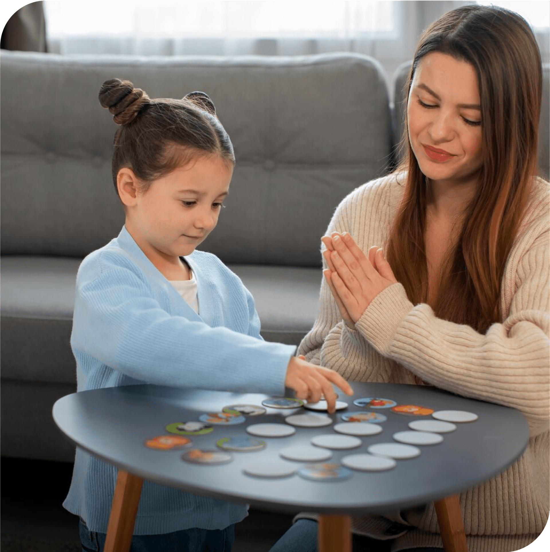 Mother and child in play therapy using a matching game. Parent-child play therapy in Thornhill, Vaughan, at Young Sprouts Therapy.