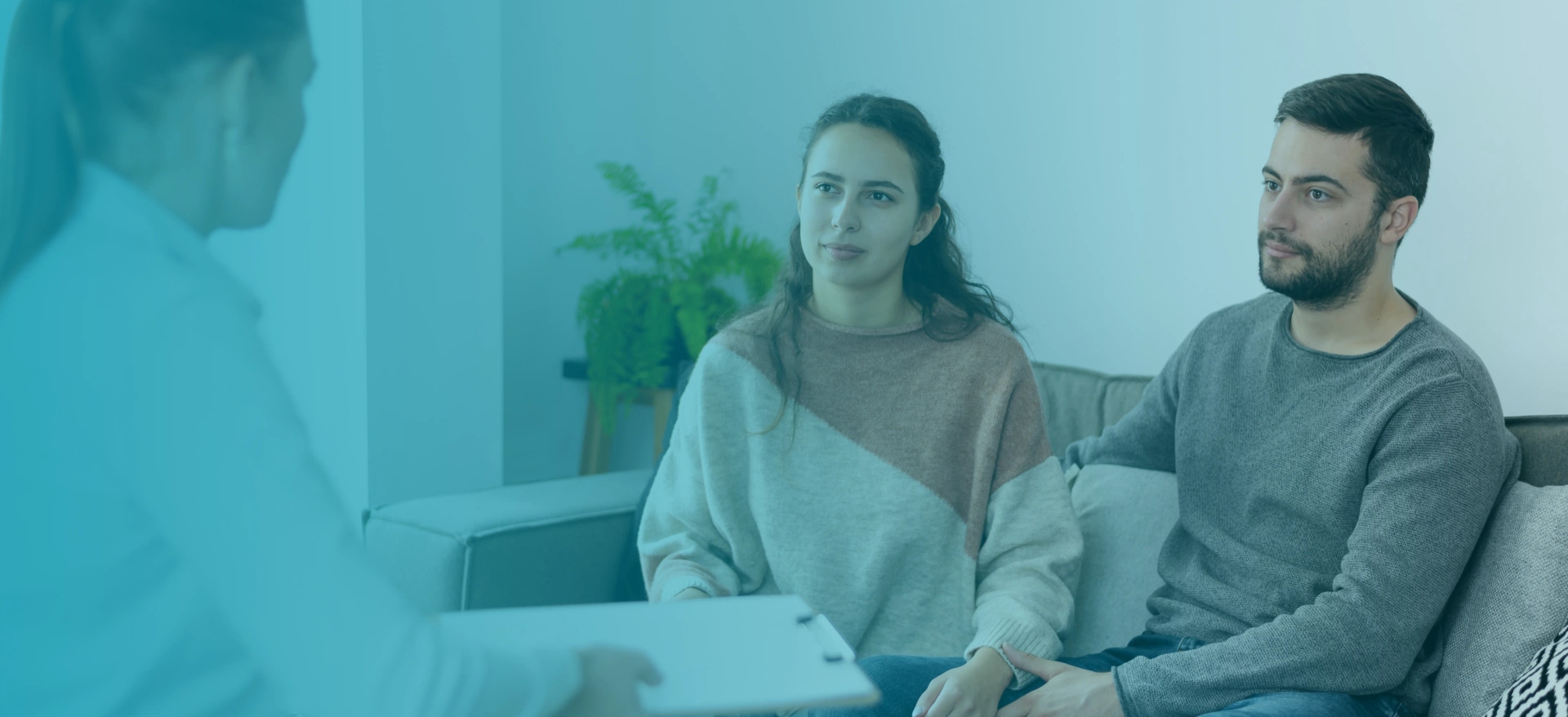 Parents speaking with a therapist at Young Sprouts Therapy in Vaughan, illustrating counselling with CBT and play therapy for kids and families.