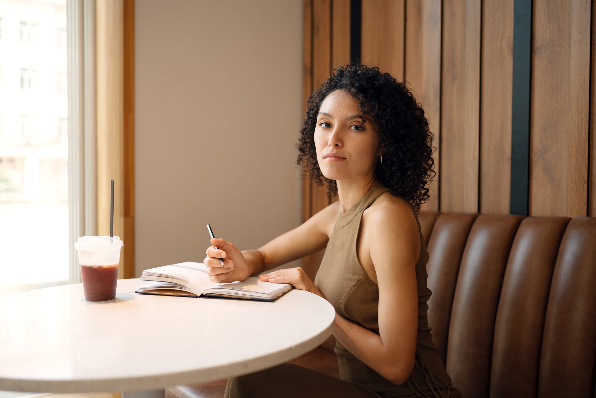 Woman reflecting after therapy, symbolizing self-compassion, confidence, and identity work in counselling