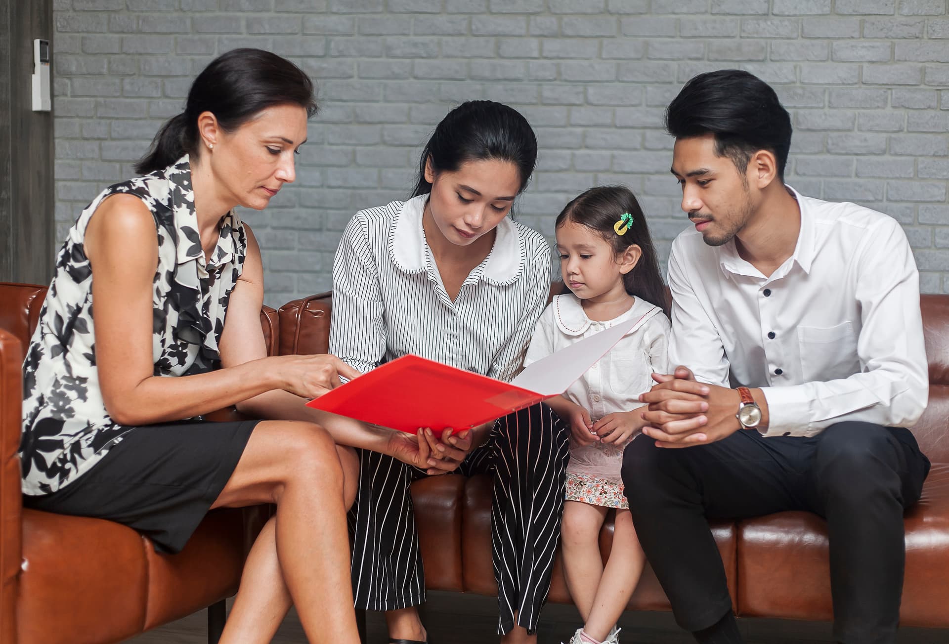 Therapist discussing occupational therapy diagnoses and treatment plan with family in Thornhill