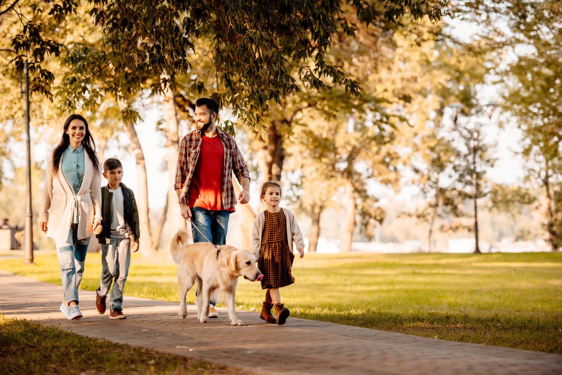 Family walking together in a Vaughan park after a therapy session