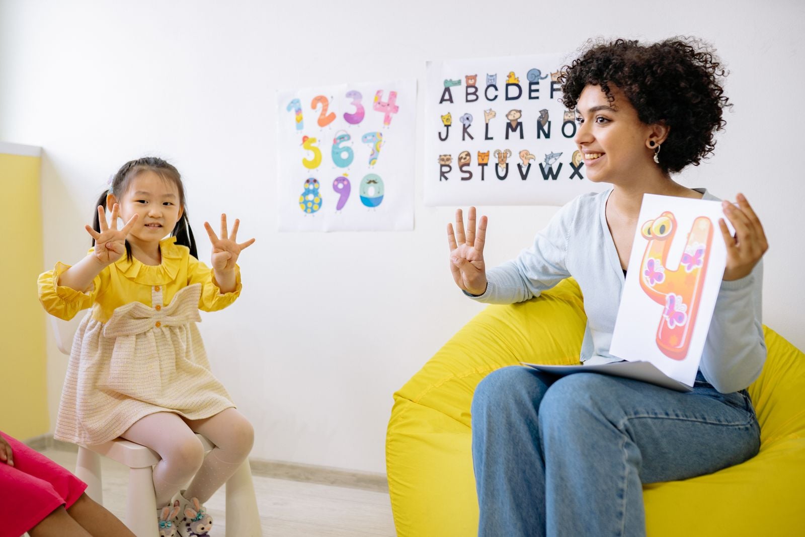 Occupational therapist working one-on-one with a child on developmental learning goals