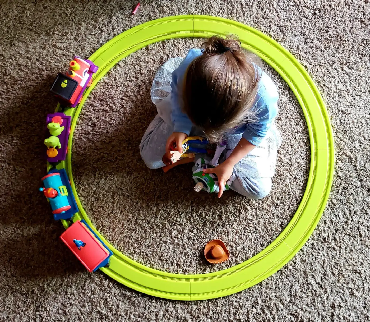 Young child playing with toy figures, a normal way kids work through grief