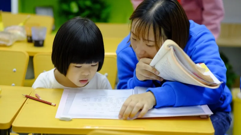 Parent reviewing a child's report card at home in York Region