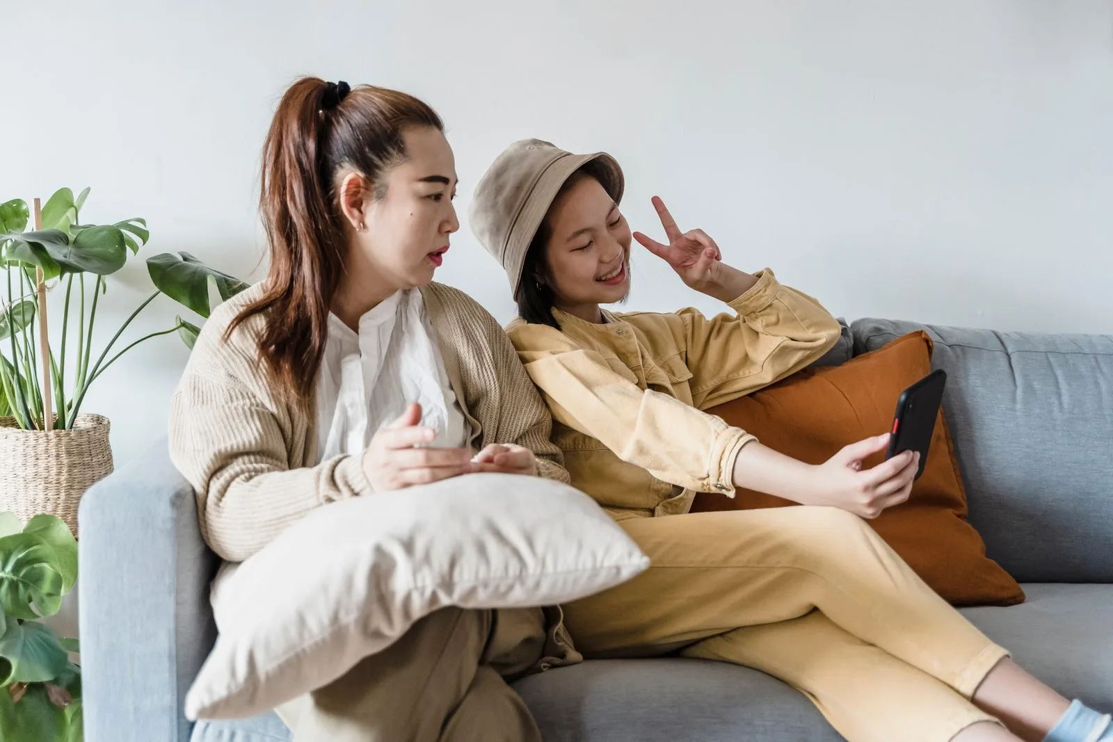 Parent and teenager sitting together, reconnecting after a difficult stretch