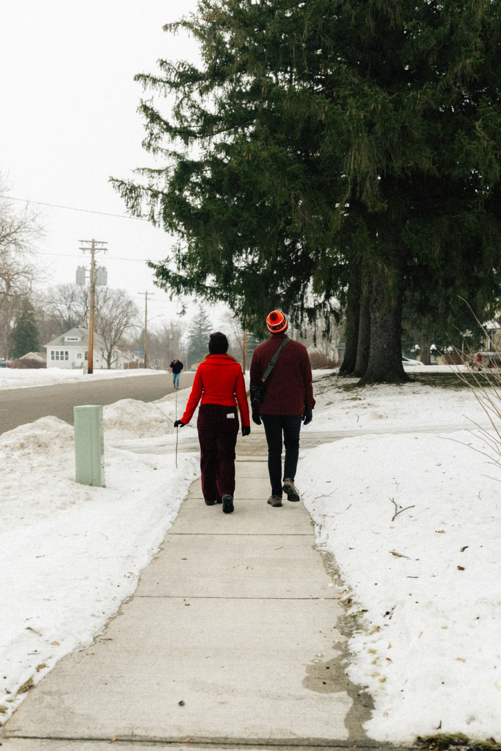 Parent and teenager walking outdoors in winter daylight to help boost mood and energy