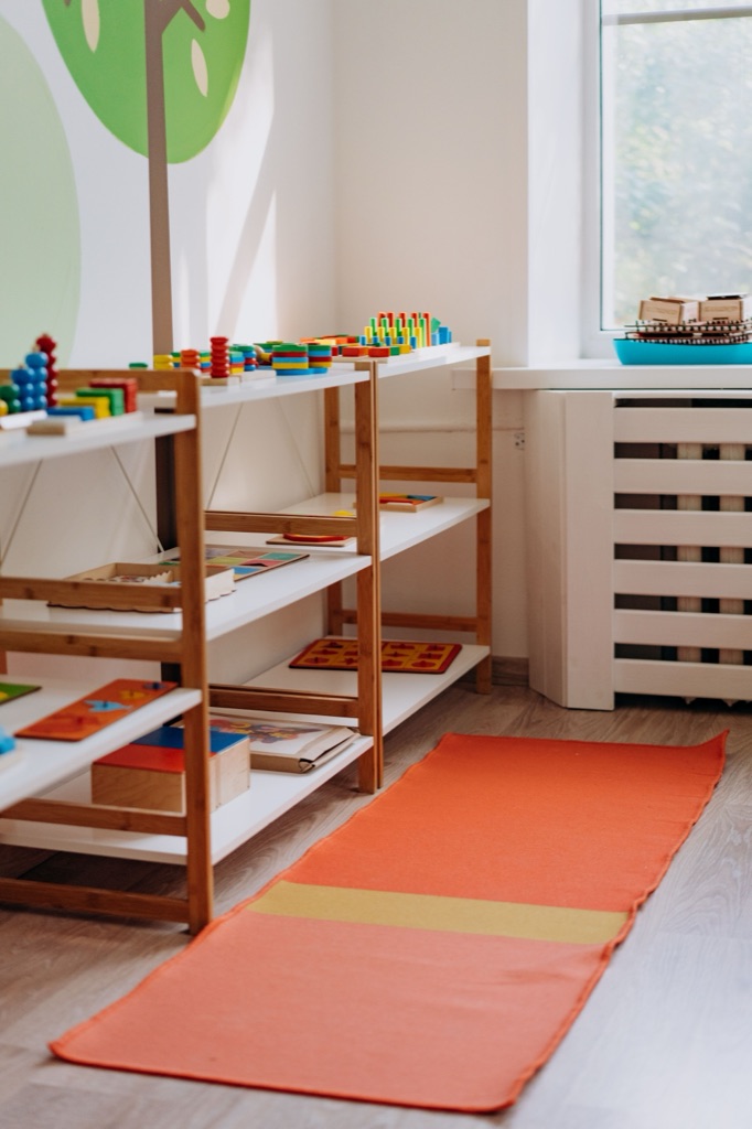 Bright, welcoming child therapy playroom with shelves of colourful games and puzzles, where kids in Thornhill and Vaughan build emotional regulation skills