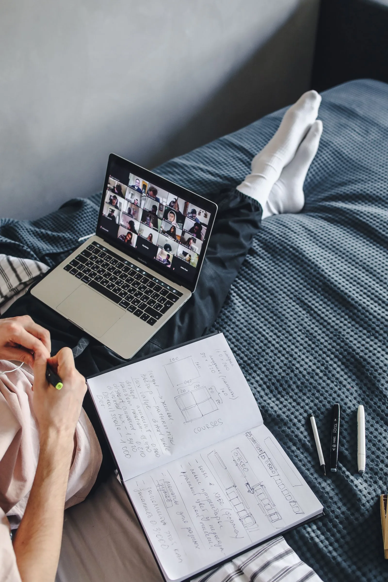 Teenager on a laptop in their bedroom during an online therapy session